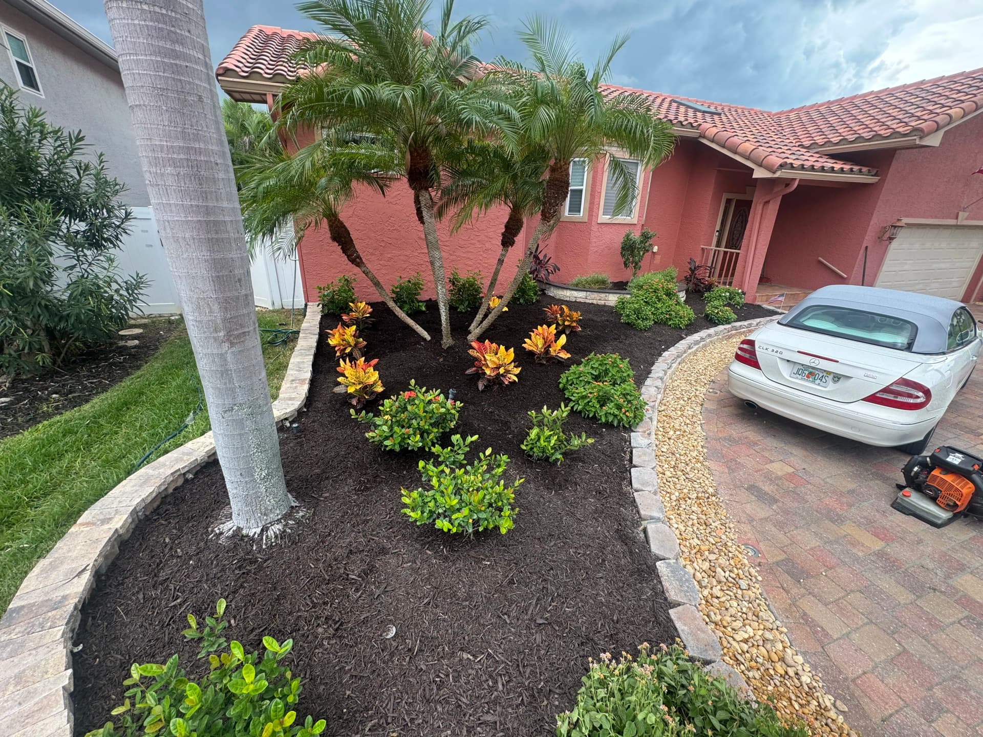 Front Yard Garden Bed Cleanup with Fresh Mulch and River Rock image