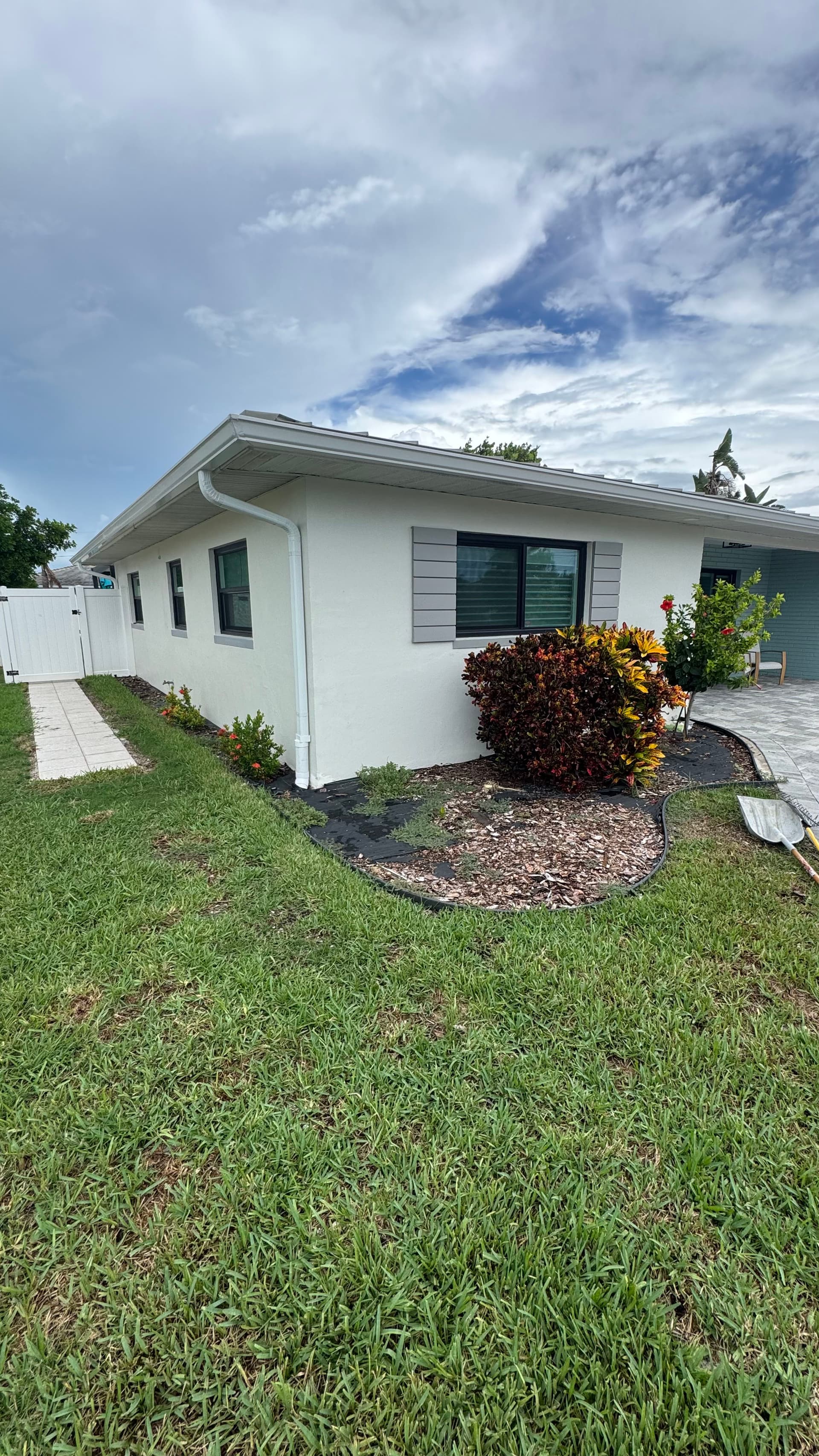 Gallery photos for Front Yard Upgrade With Palms, Ixora, and Caribbean Beach Pebbles: Image #3