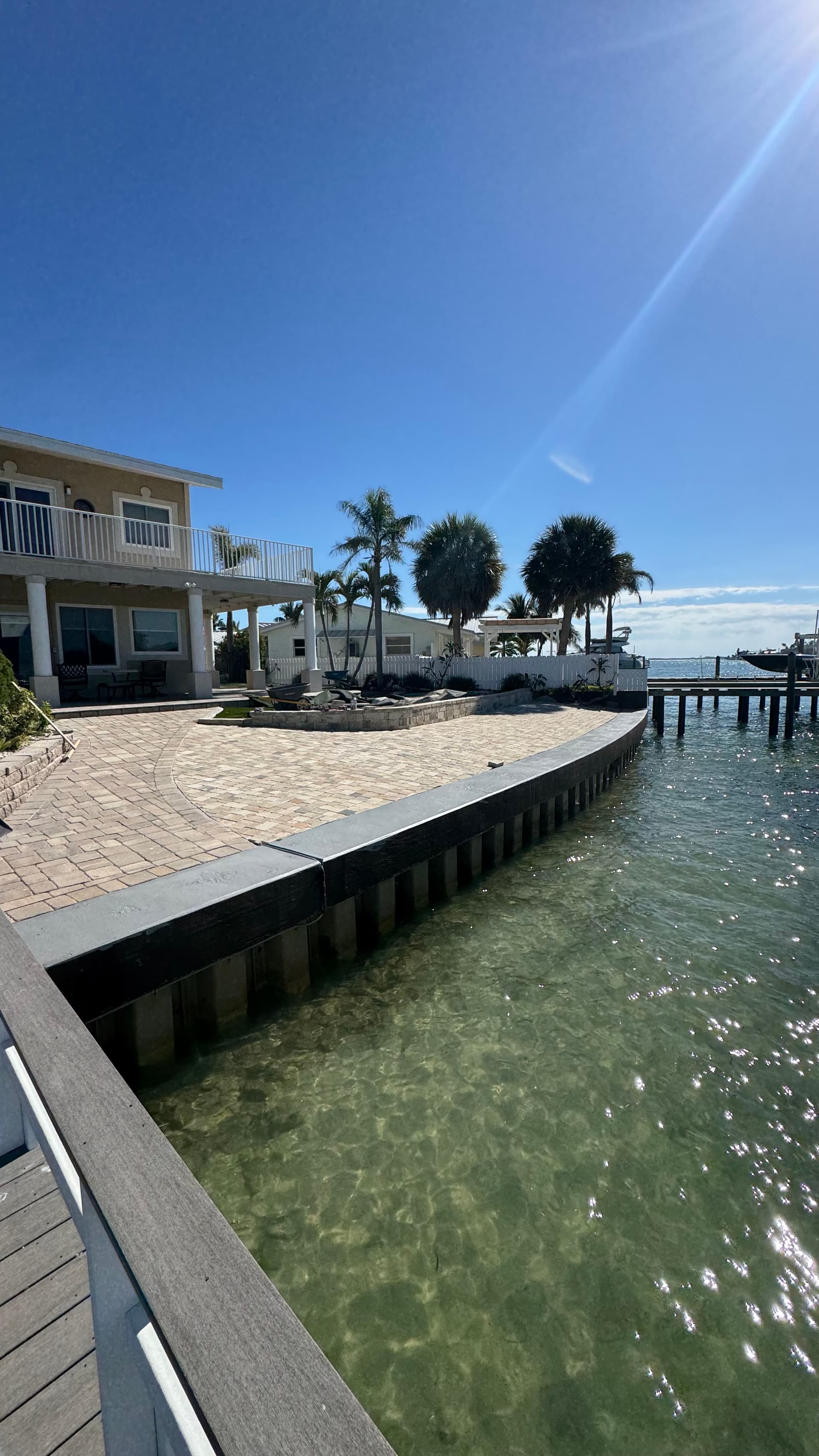 Waterfront Patio, Retaining Wall and Putting Green Done Right image
