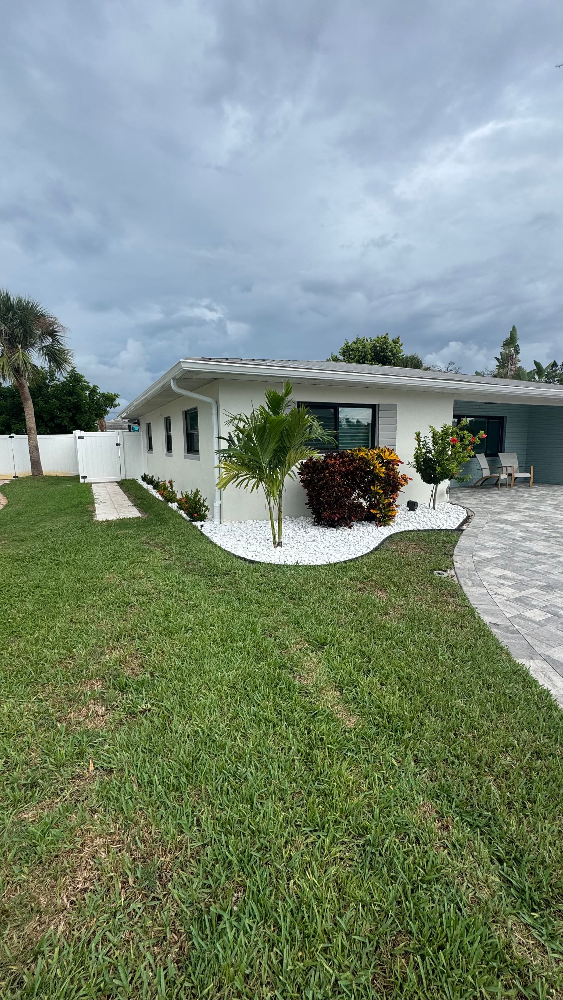Gallery photos for Front Yard Upgrade With Palms, Ixora, and Caribbean Beach Pebbles: Image #1
